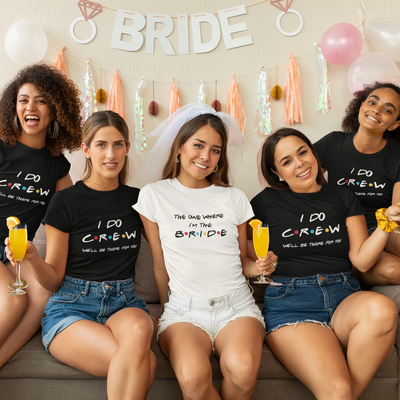 Group of women wearing matching Friends I Do Crew bachelorette shirts celebrating a bridal weekend