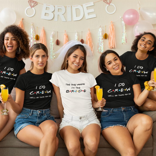 Group of women celebrating a bachelorette party with 'I DO CREW' shirts and a bride in the center.