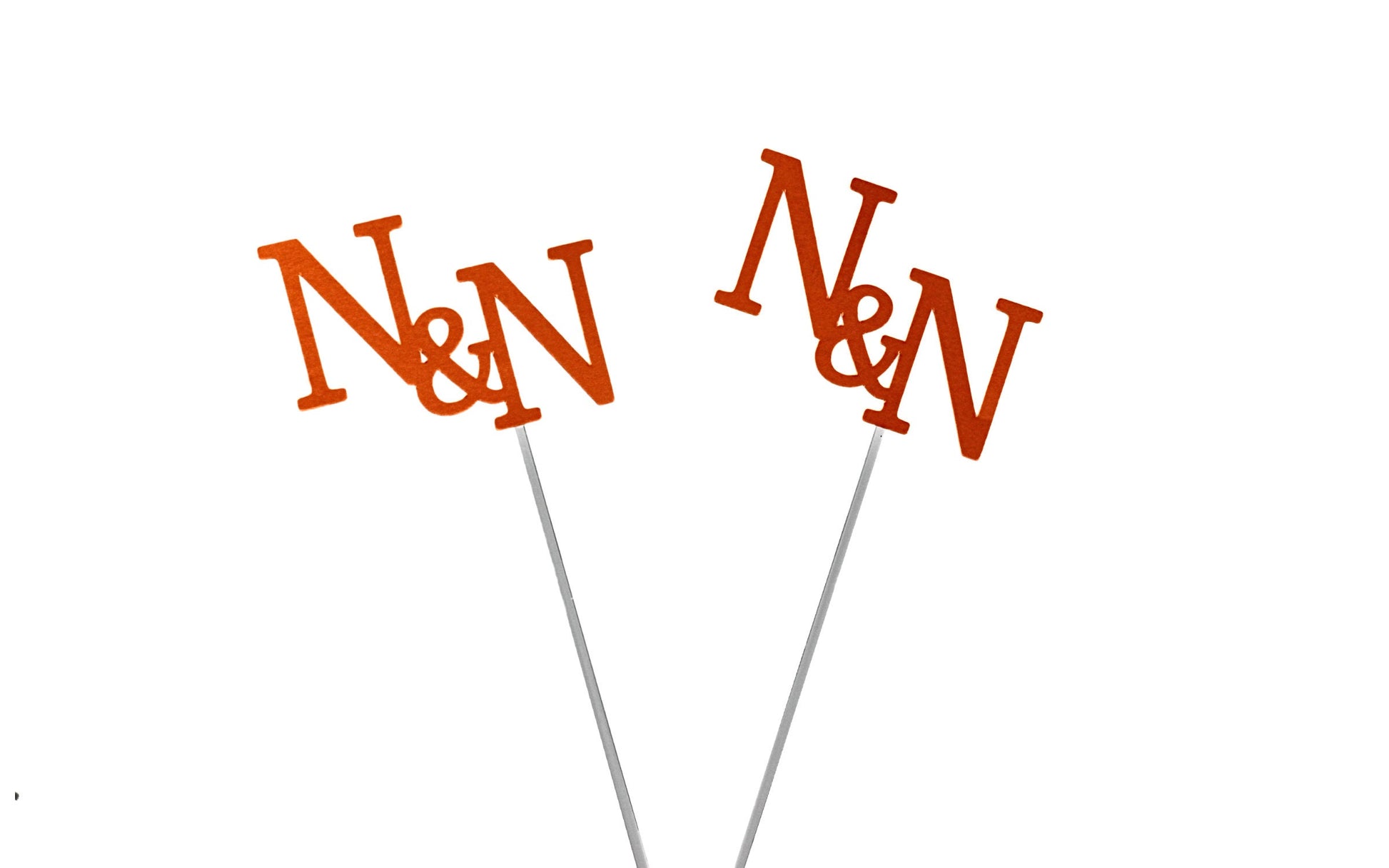 Custom initial sticks for engagement party and welcome dinner décor