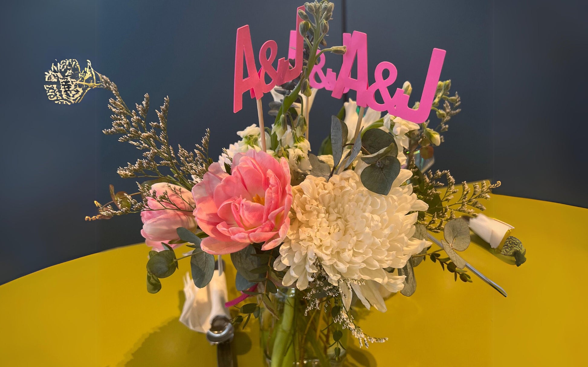 Close-up of custom bridal shower initial sticks made from cardstock